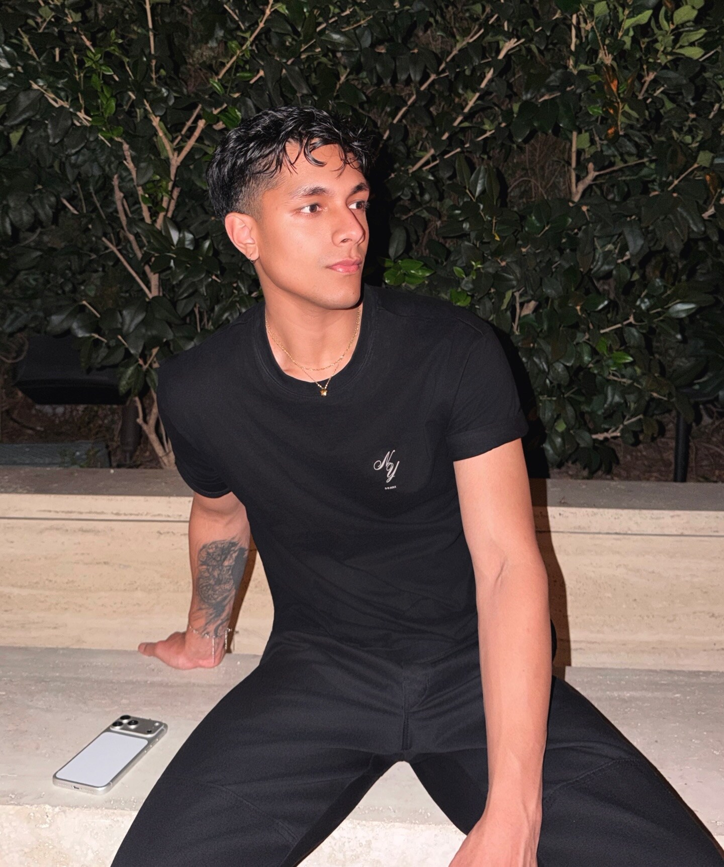 Aryan Mahajan seated outdoors in a black shirt