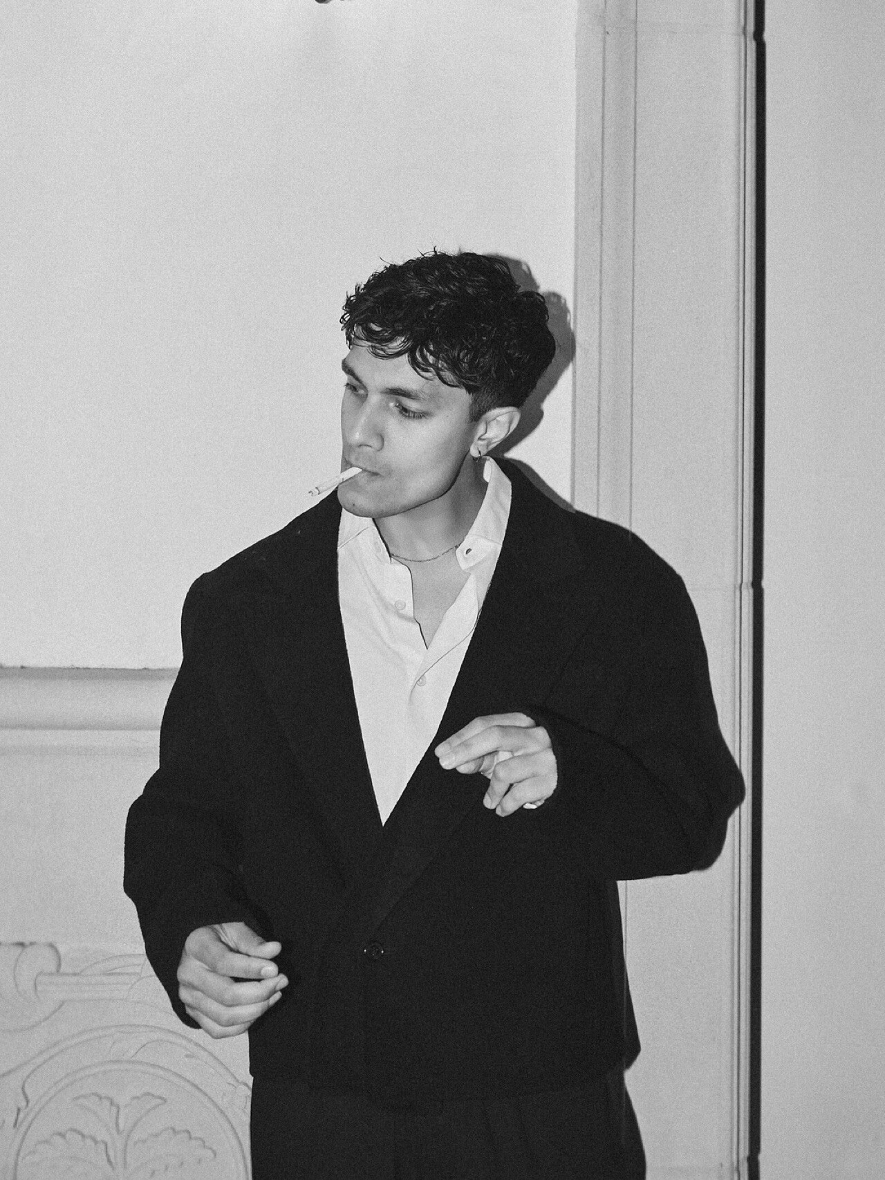 Black-and-white portrait of Aryan Mahajan wearing a dark suit and white shirt