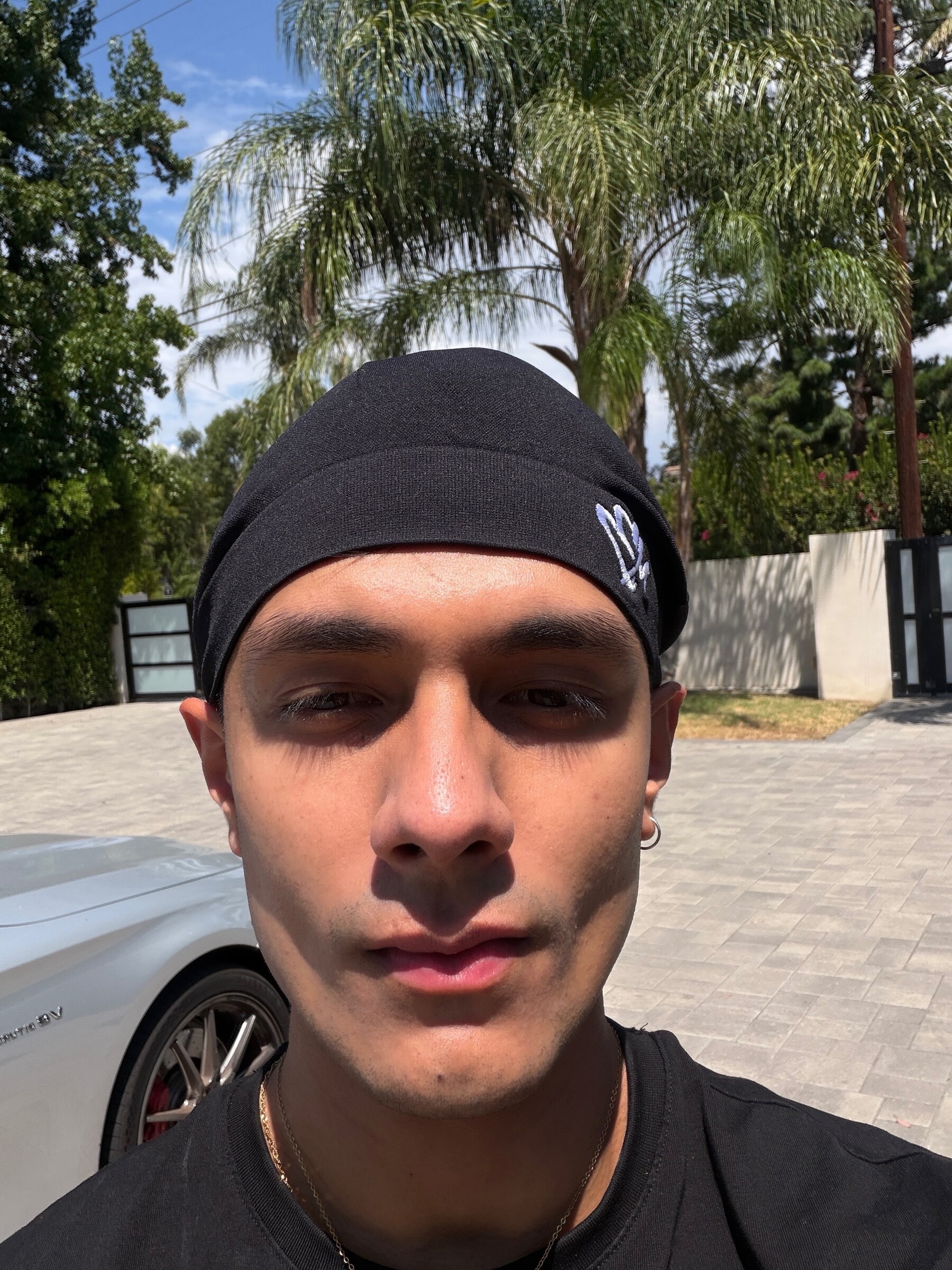 Close daytime selfie of Aryan Mahajan wearing a black durag in Los Angeles